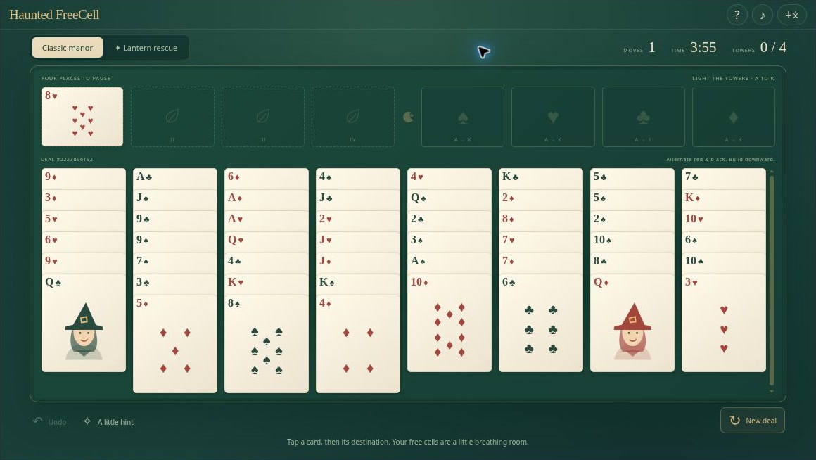 Haunted FreeCell showing eight card columns, four free cells, four foundations, and Halloween character cards